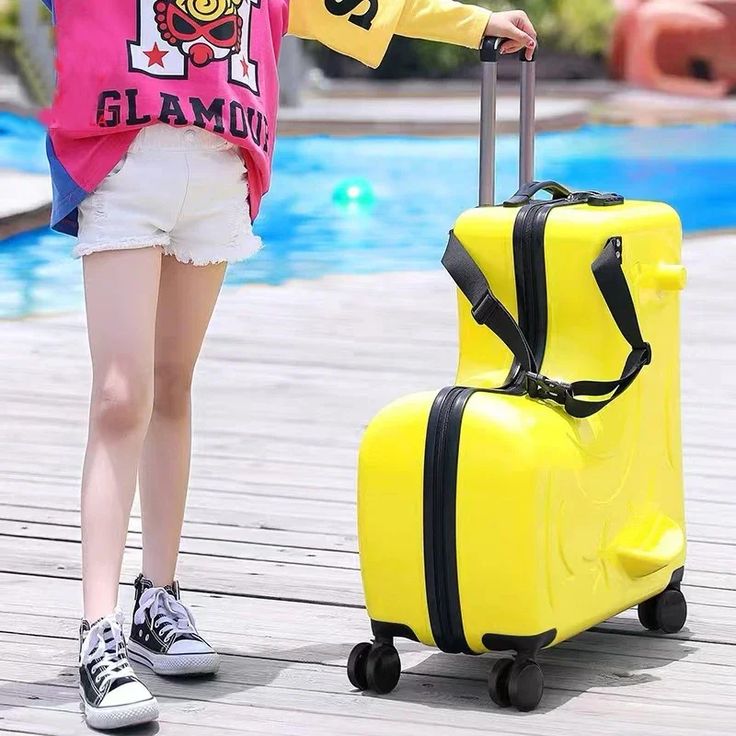 kids riding suitcase