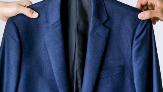 how to fold suit in suitcase